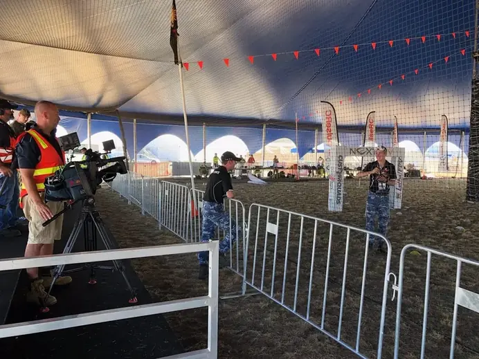FPV drone racing under a Somersault marquee at an airshow